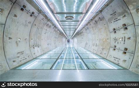 Samyan Mitrtown tunnel. Empty Sci-Fi modern futuristic cyber room with hallway and lights in smart technology and business concept. Interior design. Metro subway in Bangkok City, Thailand.