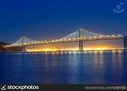 San Francisco Bay Bridge at sunset from Pier 7 in California USA