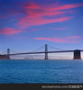 San Francisco Bay bridge from Pier 7 sunset in California USA