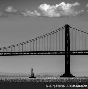 San Francisco Bay bridge sailboat from Pier 7 in California USA