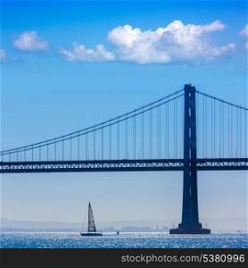San Francisco Bay bridge sailboat from Pier 7 in California USA