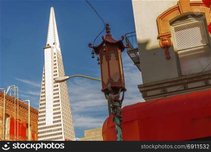 San Francisco, CA, USA, october 22, 2016: decorated street lamp in San Francisco Chinatown with Transamerica Pyramid building in background