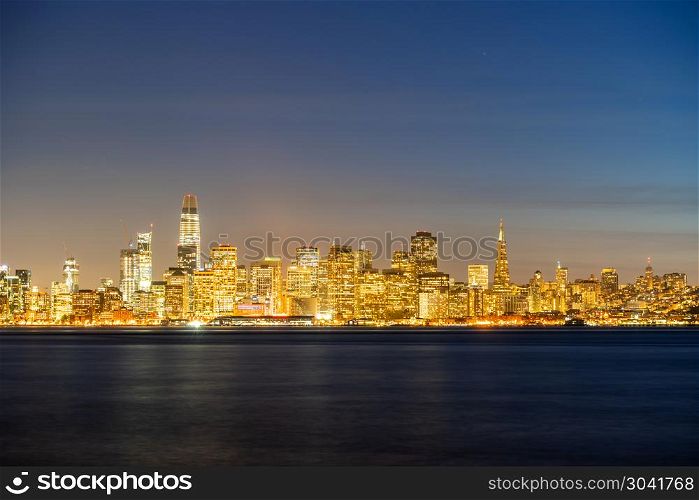 San Francisco downtown skyline at dusk from Treasure Island, California, sunset, USA.. San Francisco downtown skyline