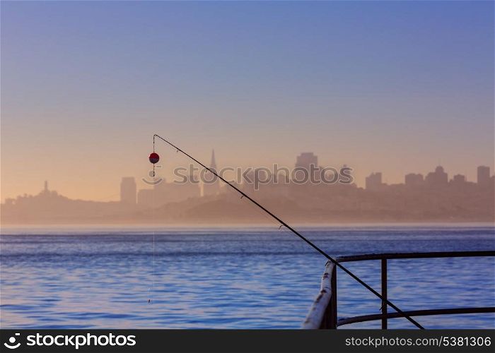 San francisco fog skyline with fishing rod in the mist California USA