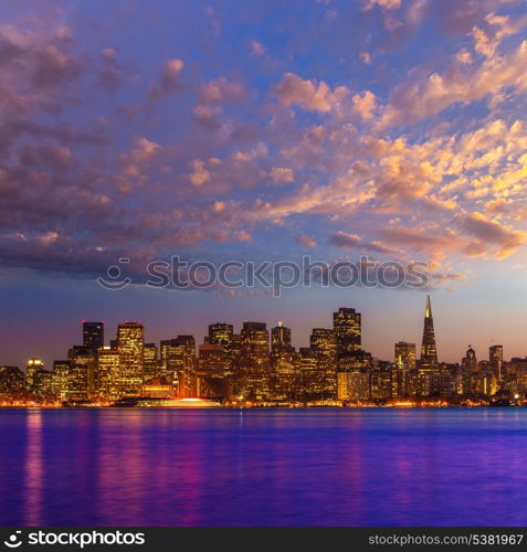 San Francisco sunset skyline in California with reflection in bay water USA