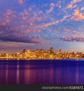 San Francisco sunset skyline in California with reflection in bay water USA