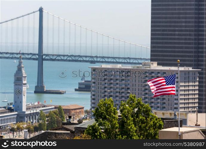 San Francisco USA American Flag Bay Bridge and Embarcadero Clock Tower from Telegraph Hill