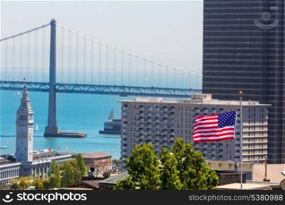 San Francisco USA American Flag Bay Bridge and Embarcadero Clock Tower from Telegraph Hill