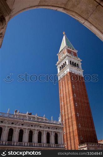 San Marco bell tower rises above an arch in Venice