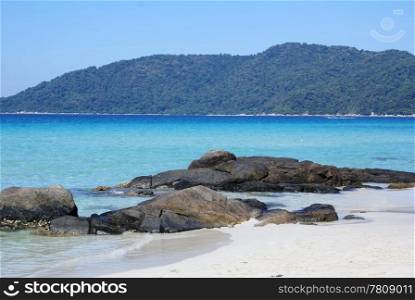 Sand and boulders on the beach, Perhentian island, East Malaysia