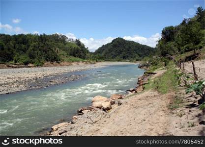 Sand and rapid river in rural area of Fiji