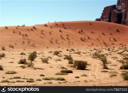 Sand barhan and rock in Wadi Rum desert, Jordan