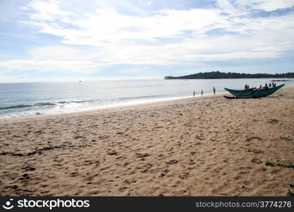 Sand beach and boat in Arugam bay, Sri Lanka