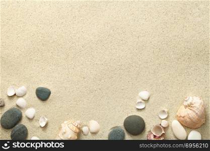 Sand, beach background with shells and stones. Copy space. Top view. Sand, Beach Background with Shells and Stones