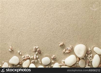 Sand, beach background with shells and stones. Copy space. Top view. Sand, Beach Background with Shells and Stones