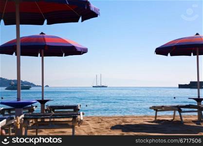 sand beach in Giardini Naxos (seaside town in Sicily) and view on Calabria mountains on horizon