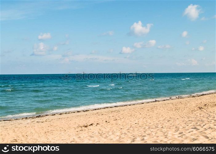 Sand beach on the bright summer day