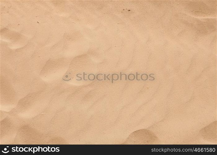 Sand beach with waves formed by the air