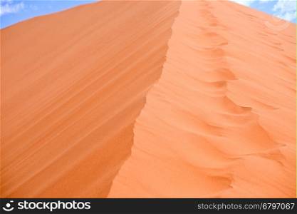 sand dune with blue sky