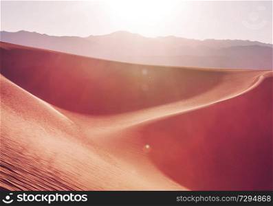 Sand dunes in Death Valley National Park, California, USA. Living coral toned.