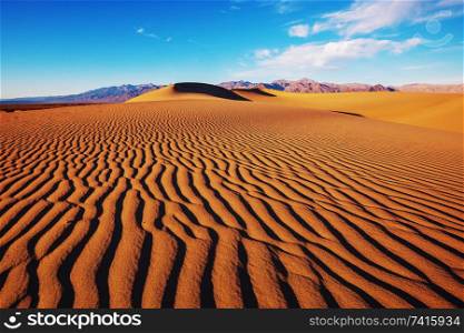 Sand dunes in Death Valley National Park, California, USA. Living coral toned.