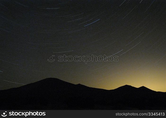 sand dunes with star trails