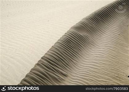 Sand formations after a stormy day by the coast of Gran Canaria at the Canary Islands in Spain