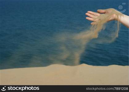 sand in female hand