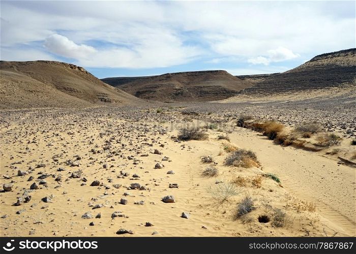 Sand in ravine and mountain in Negev desert, Israel