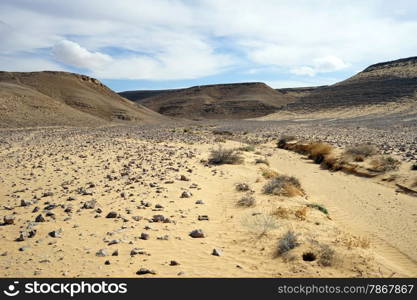 Sand in ravine and mountain in Negev desert, Israel