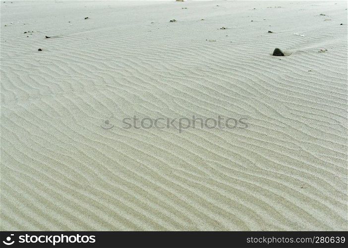 sand ripples, wavy sand surface, sandy smooth sea shore. wavy sand surface, sandy smooth sea shore, sand ripples