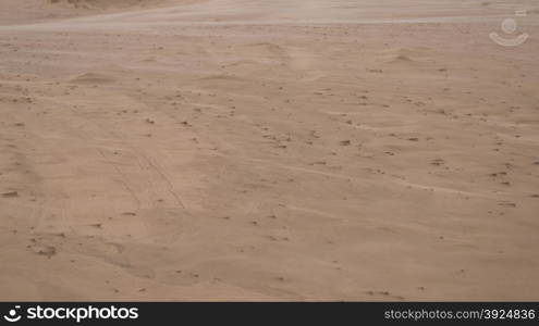 Sand sculpture on sand dune. Macro of small sand sculptures on a dune formed by storm and wind