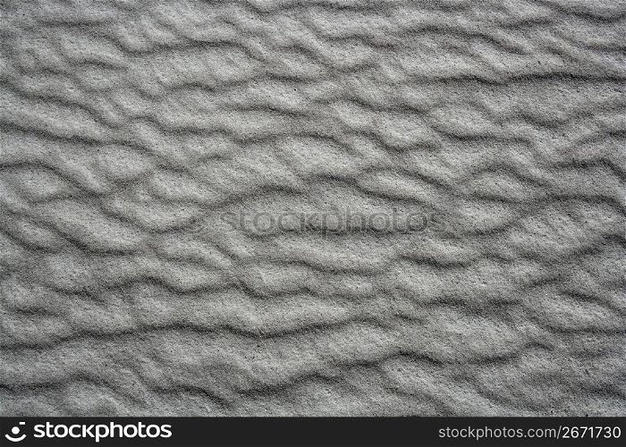 sand waves testure on white sands like desert