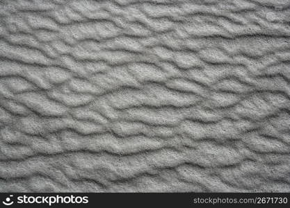 sand waves testure on white sands like desert