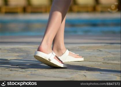 Sandals in front of a pool. Sandals in front of a pool . Sandals in front of a pool on the island of Crete