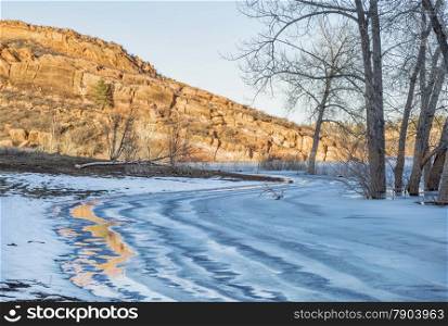 sandstone cliff and frozen lake - Horsetooth Reservoir in Fort Collins, Colorado