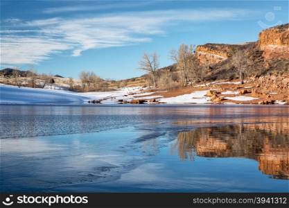 sandstone cliff over Horsetooth Reservoir and Lory State Park at winter sunset, Fort Collins, Colorado