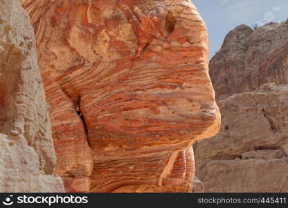 Sandstone coloured red, orange and black by iron and manganese compounds in the World Heritage of Petra, Jordan