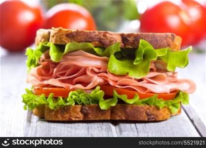 sandwich with bacon and vegetables