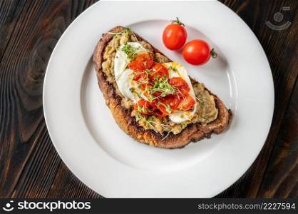 Sandwich with baked eggplant, tomatoes and mozzarella