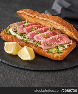 Sandwich with cream cheese, tuna and sesame seeds