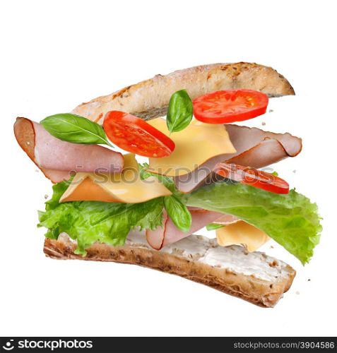 Sandwich with falling ingredients in the air isolated on white - slices of fresh tomatoes, ham, cheese and lettuce