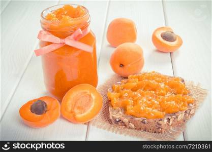 Sandwich with fresh homemade natural apricot jam and ripe fruits, concept for healthy snack. Sandwich with natural apricot jam and ripe fruits, concept for healthy snack