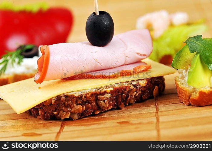 Sandwich with ham and cheese and other vegetables