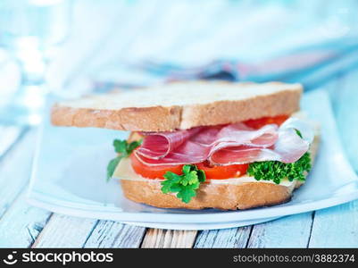 sandwich with ham and vegetables on the plate