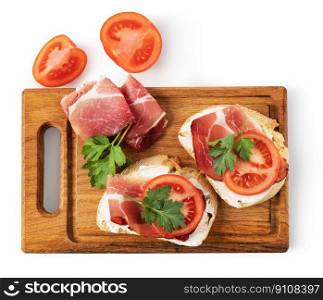 sandwich with prosciutto and tomato isolated on white background. sandwich with prosciutto