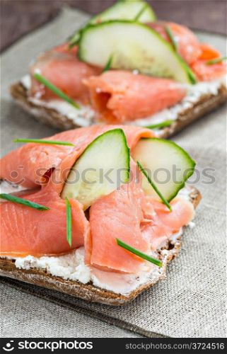 Sandwich with salmon for breakfast, selective focus