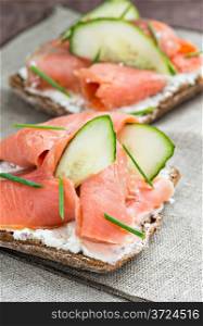 Sandwich with salmon for breakfast, selective focus