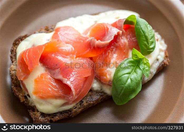 Sandwich with trout, mozzarella and tomatoes