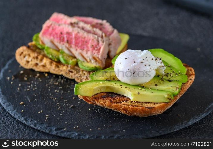 Sandwich with tuna, avocado and poached egg